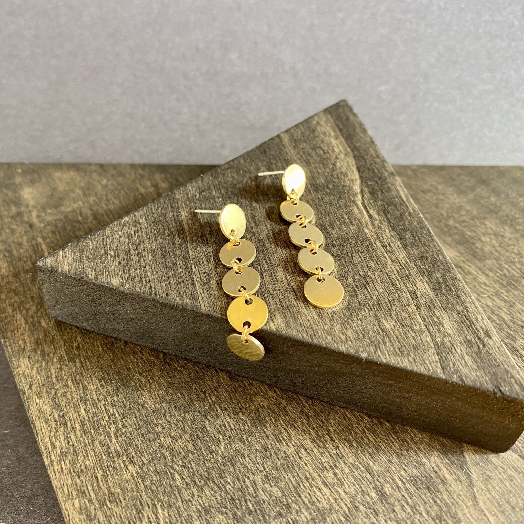 brass five dot dangle