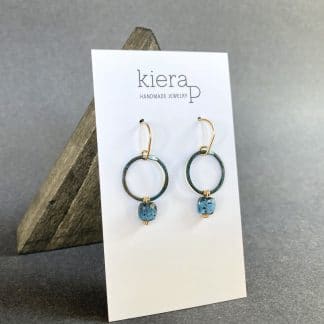 faceted kyanite square on blue patinaed copper hoop